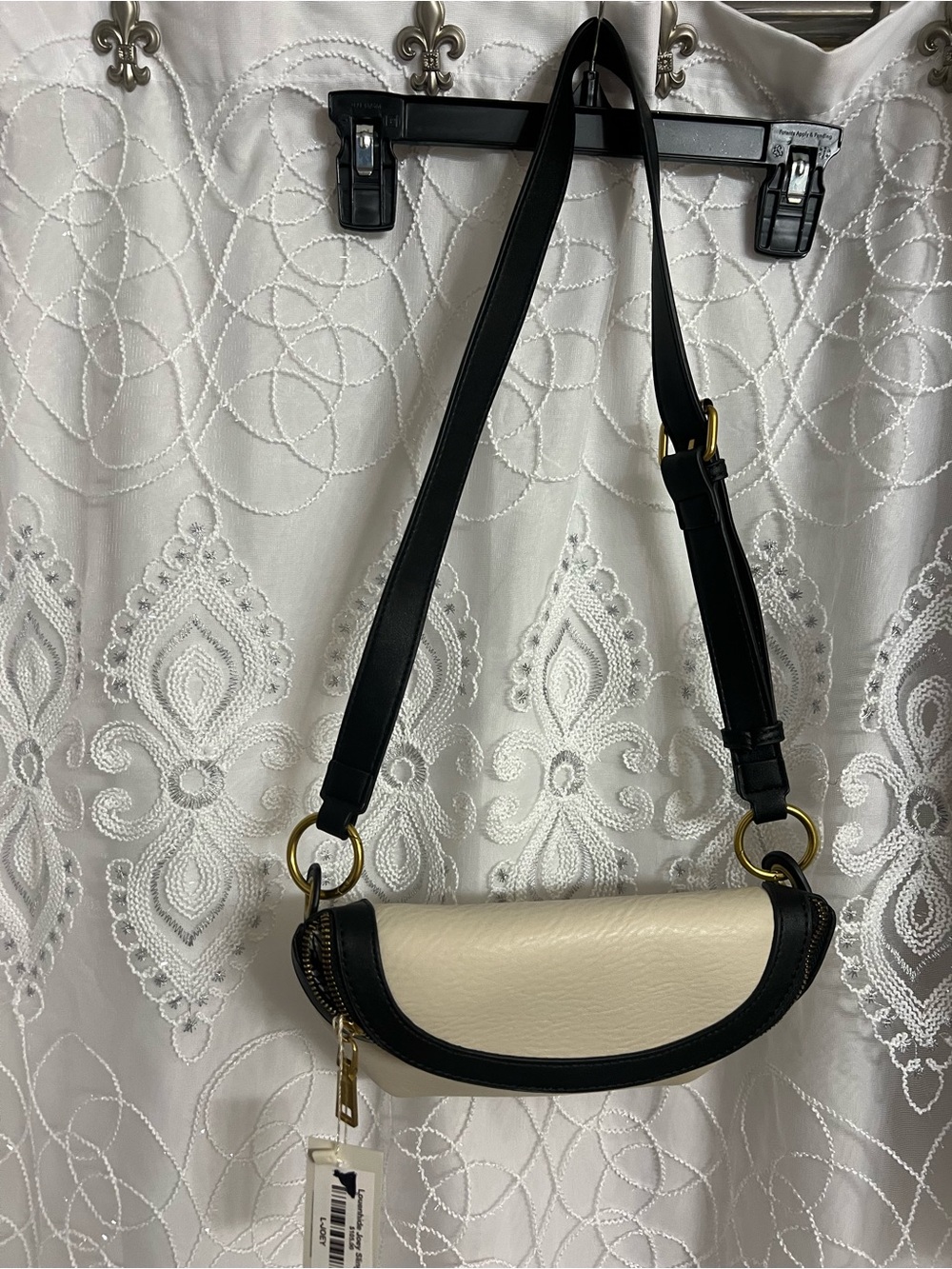 Two-Tone Cream and Black Crescent Crossbody Bag with Gold Hardware